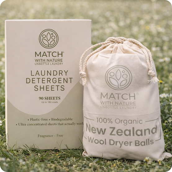 Match with Nature laundry detergent sheets packaging and organic wool dryer balls bag on grass
