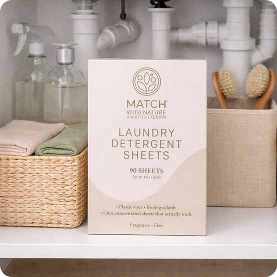 Box of Match with Nature laundry detergent sheets in a bathroom setting.