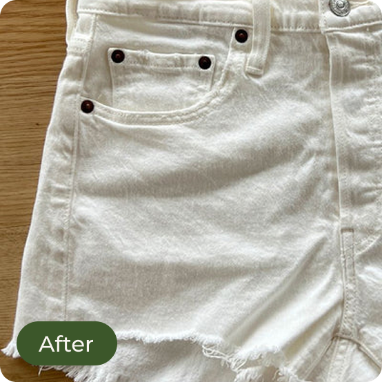 White denim shorts with a 'After' label on a wooden surface