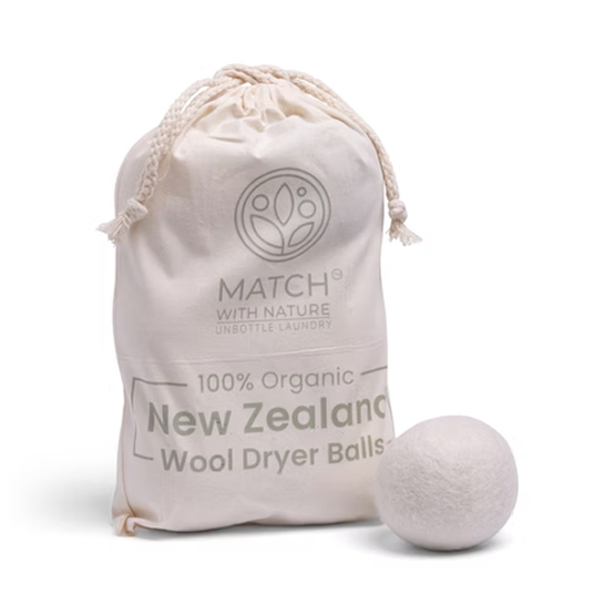 Wool dryer ball with a branded cotton drawstring bag on a white background