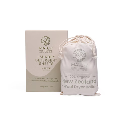 Match with Nature laundry detergent sheets packaging and wool dryer balls on a white background