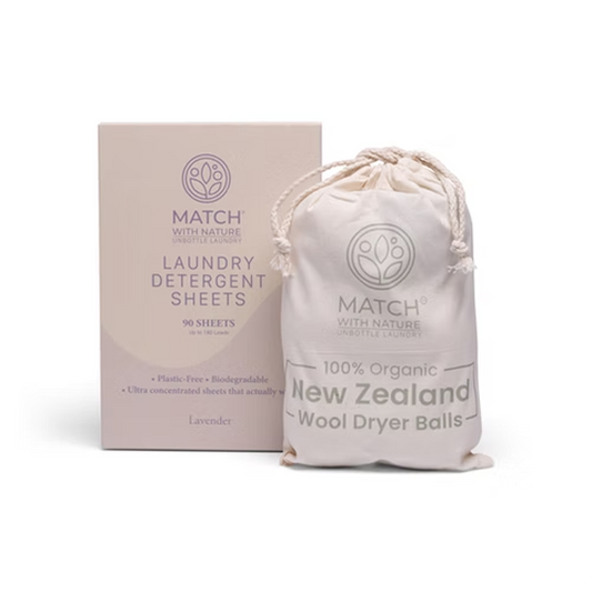Match with Nature laundry detergent sheets packaging and wool dryer balls on a white background