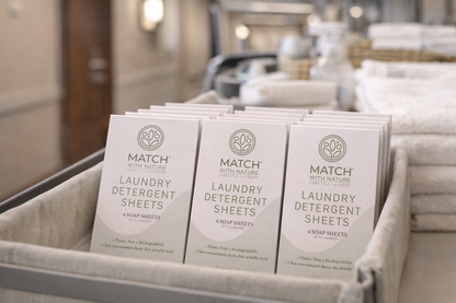 Three packages of Match with Nature laundry detergent sheets in a basket.