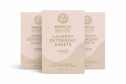 Three boxes of Match with Nature laundry detergent sheets on a white background