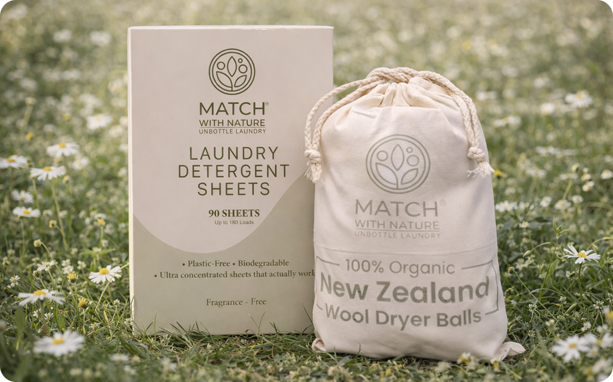 Match with Nature laundry detergent sheets packaging and organic wool dryer balls bag on grass