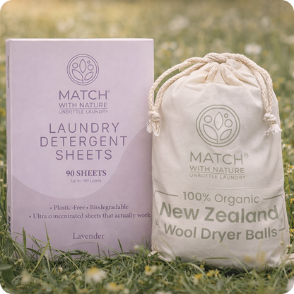 Match with Nature laundry detergent sheets and wool dryer balls packaging on grass