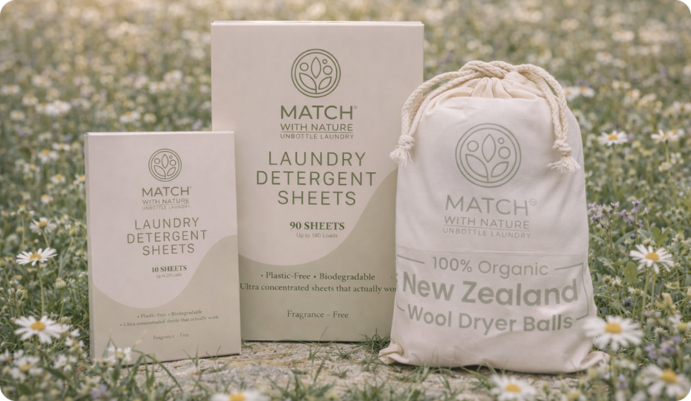 Lifestyle view of eco-friendly laundry products including wool dryer balls and detergent sheets