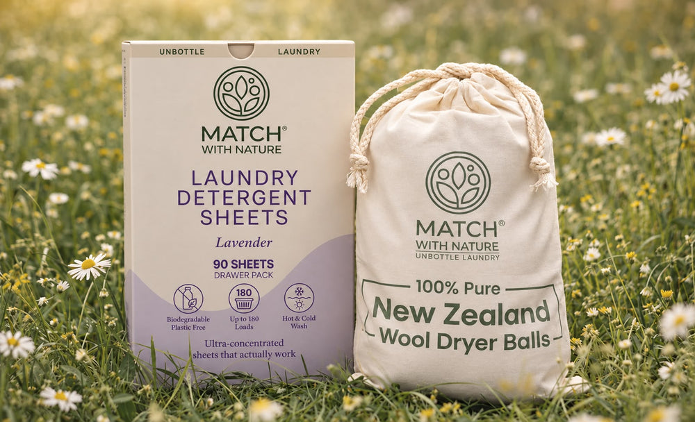 Lifestyle view of eco-friendly laundry products including wool dryer balls and detergent sheets